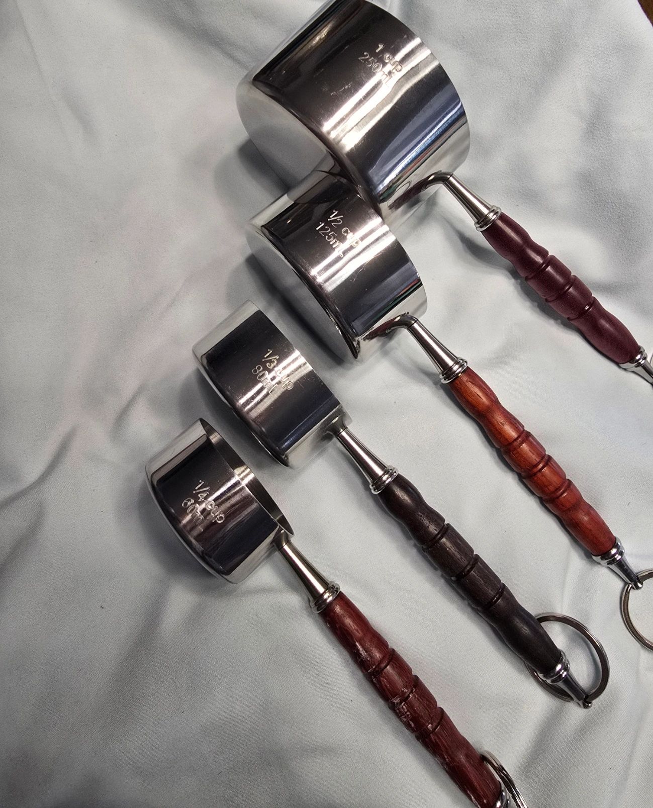 Four professional paint brushes with wooden handles
